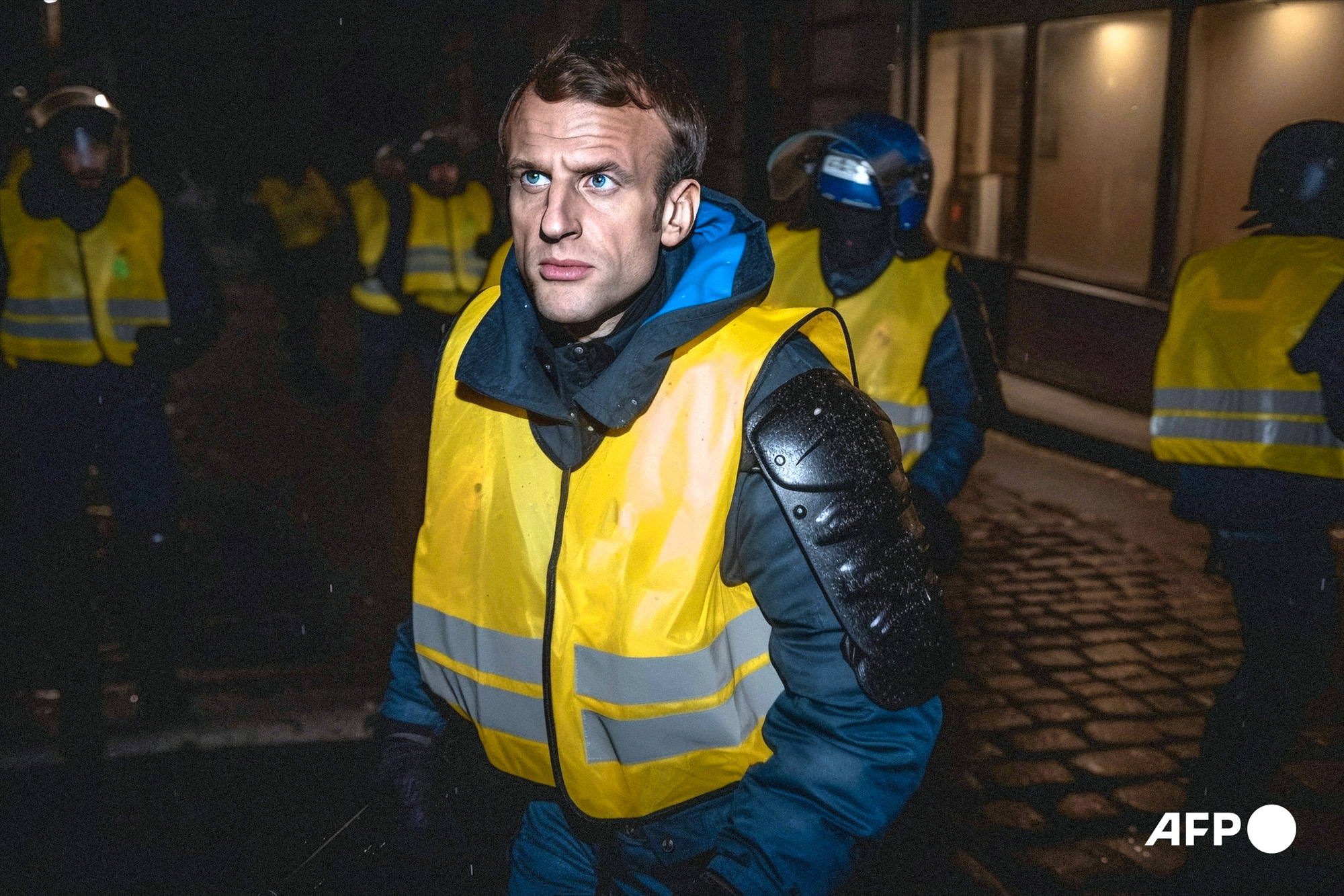 Emmanuel Macron deep fake, in CRS uniform wearing Yellow Vest. March 2023 in Paris